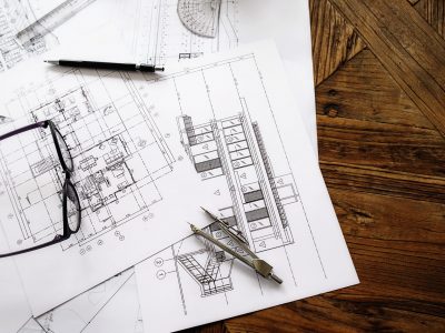 image-engineering-objects-workplace-top-view-construction-concept-engineering-tools-vintage-tone-retro-filter-effect-soft-focus-selective-focus-scaled-1.jpg